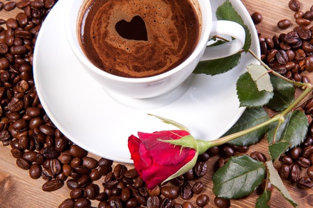 White cup of black coffee with little heart on coating. For themes like love, valentine's dayの写真素材