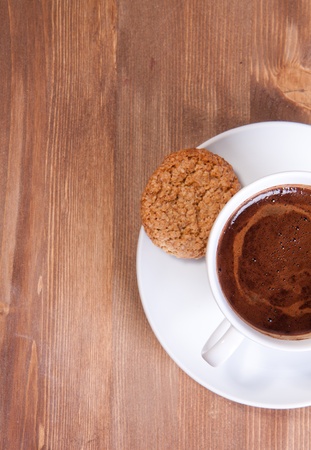 White cup of black coffee with cookiesの写真素材