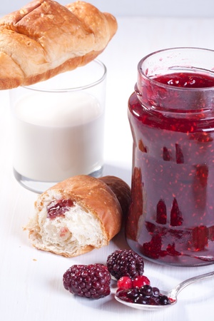 Breakfast with croissant, fresh berrys and strawberry jamの写真素材