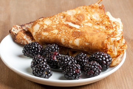 Plate of pancakes with fresh blackberriesの写真素材