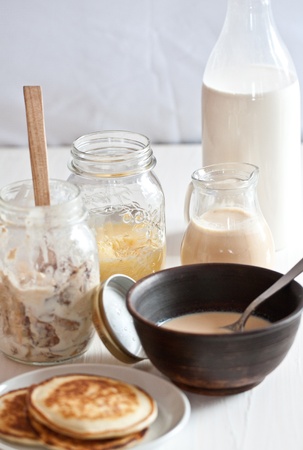 Mix of with milk homemade products with pancakesの写真素材