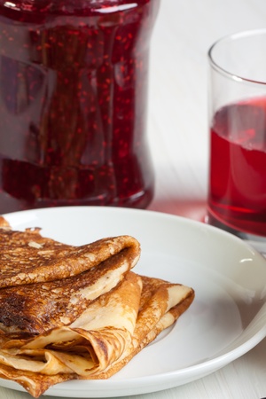 Breakfast with pancakes and strawberry jamの写真素材