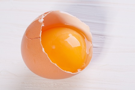 Half of Broken egg on white tableの写真素材