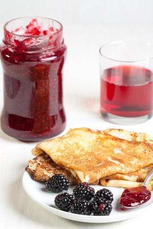 Plate of pancakes with fresh blackberriesの写真素材