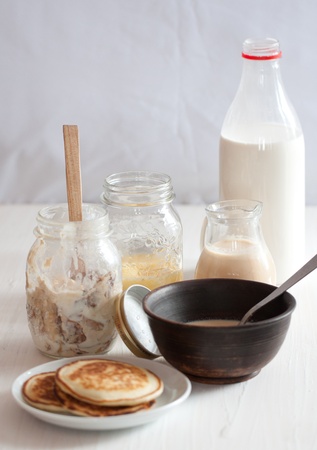 Mix of with milk homemade products with pancakesの写真素材