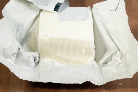 Open Block of Butter on wooden table