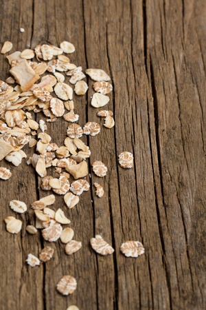 Background with dry muesli on old wooden deskの写真素材