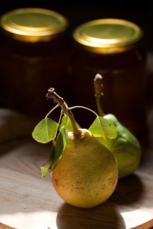 Pears on wooden table in the sunshineの写真素材
