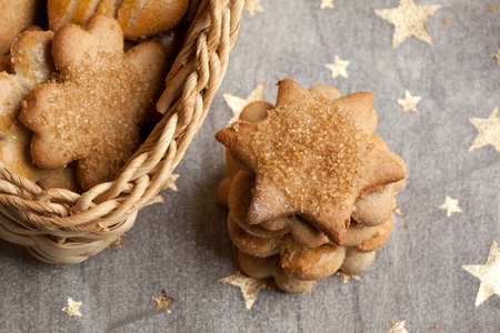 Homemade sugar cookies on white cloth with golden star