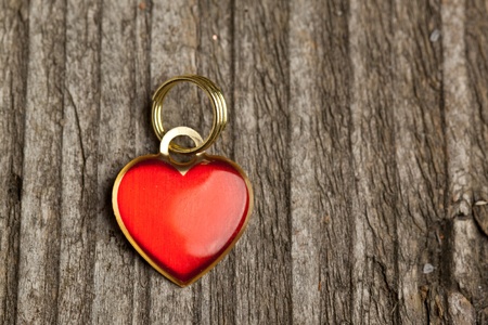 Little red heart on old wooden tableの写真素材