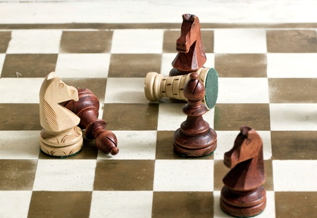 Black and white chess figures on chess deskの写真素材