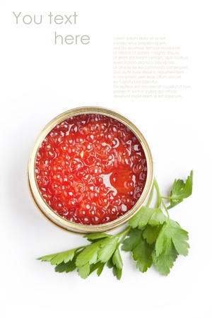 Top view on tin of red caviar and parsley isolated over white with sample textの写真素材