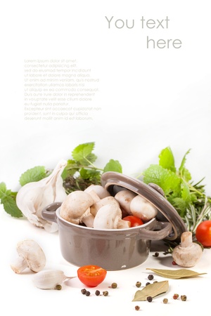 white mushrooms in pan, sliced cherry tomatoes, garlic and rosemary over white with sample text の写真素材