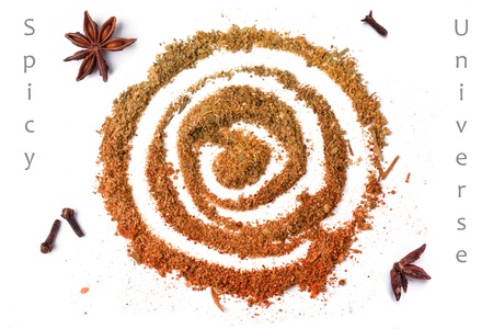 Top view on spiral of spices over white with sample textの写真素材