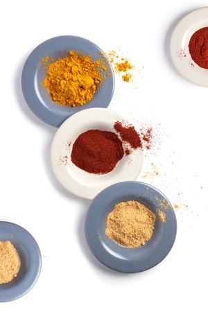 Top view on plates with mix of spices isolatedの写真素材