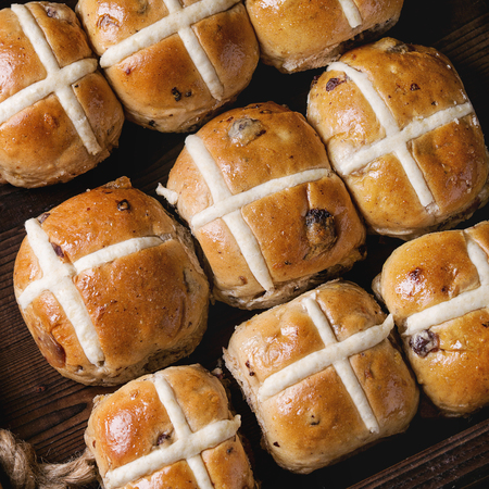 Hot cross buns in wooden tray. Close up. Top view. Easter baking. Square imageの写真素材