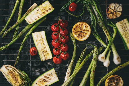 Grilled vegetables green asparagus, garlic, lemon, spring onion, zucchini, cherry tomatoes, salad on...