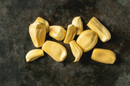 Ripe raw peeled jackfruit over dark metal background. Flat lay, spaceの写真素材
