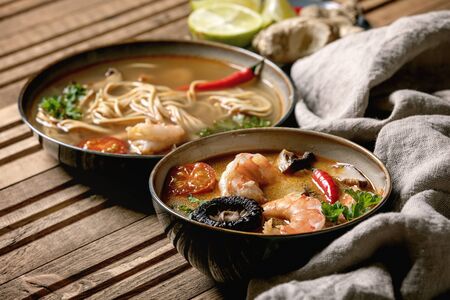 Variety of asian soups. Traditional spicy Thai tom yum kung and noodles soup with shiitake...