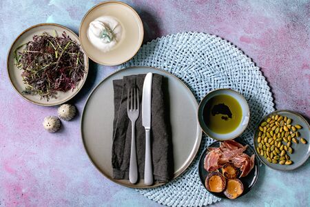 Ingredients for cooking salad. Italian burrata cheese, black arugula, grilled apricot, prosciutto,...