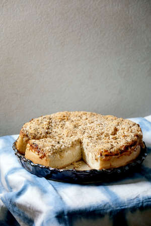 White sicilian focaccia. Traditional baked bread sliced cake with onion, herbs and cheese in ceramic...