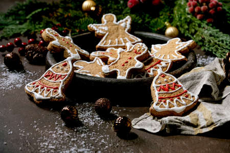 Homemade traditional Christmas gingerbread cookies with icing ornate. Gingerbread Man, angel, bell...