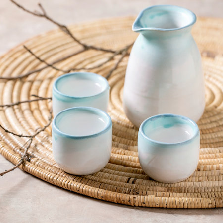 Sake ceramic set for traditional japanese alcohol drink rice wine sake, pitcher and three cups,...