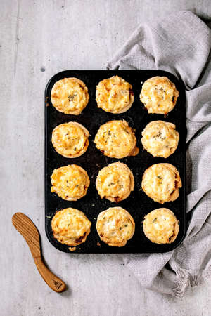 Homemade Mince meat shortcrust pastry mini pies with mashed potato and thyme in black baking tray.の写真素材