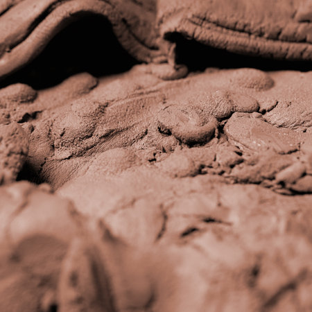 Close up of raw clay texture background. Color of year 2025 Mocha Mousse Pottery ceramics background for ceramist shop, market or workshop. Macro photographyの写真素材