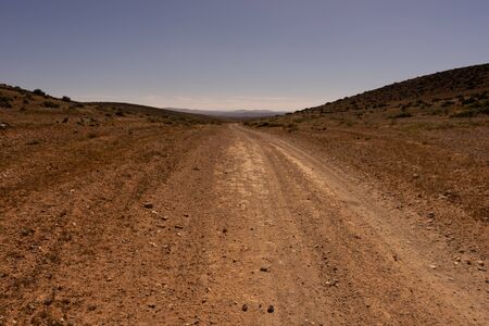 a straight track to the south near sidi ifni, morocco. the road leads to the horizon.の写真素材