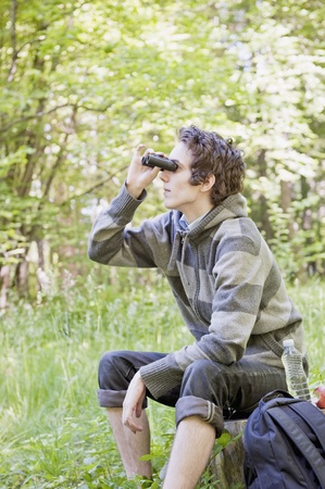 Young man birdwatchingの写真素材