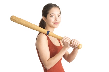 Beautiful teenage girl with wooden baseball batの写真素材