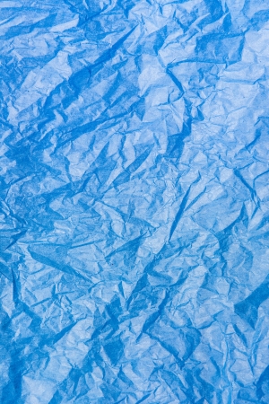 Backdrop canvas of seamless empty wrinkled blue paperの写真素材