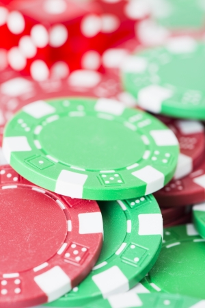 Close up of symbols for betting and winning at casino. Poker chips and dice.の写真素材