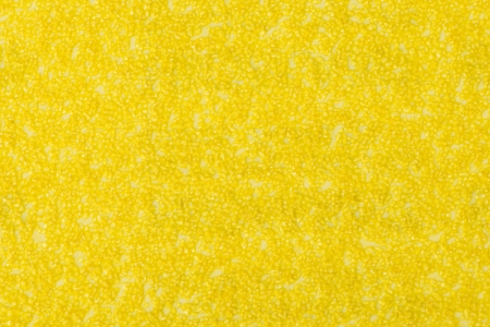 Seamless backdrop of rough textured yellow sandpaperの写真素材