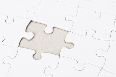 Close up of blank puzzle pieces with one missingの写真素材