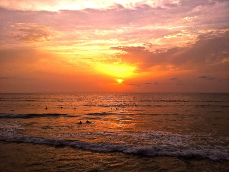 Surfers at sunsetの写真素材
