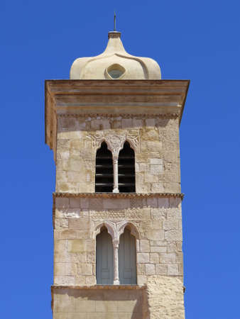 Church and bell tower of Sainte-Marie-Majeure in downtown Bonifaccio, Corsicaの写真素材