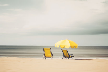Beach chair and umbrella on the beautiful tropical beach - Vintage Filterの素材