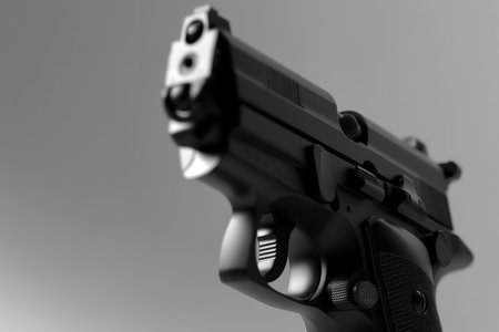 Close-up of a gun on a gray background. 3d renderingの素材