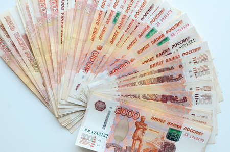 Background of bills is five thousand rubles. Concept of finance, business, income, wealth, success. Flat lay of banknotes, top view.の写真素材