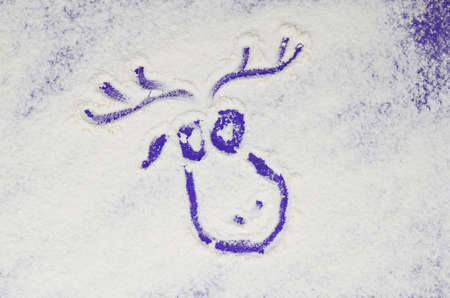 Christmas deer head in purple on white background. Winter flour background. Color of the Year 2022 Velvet violet.の写真素材