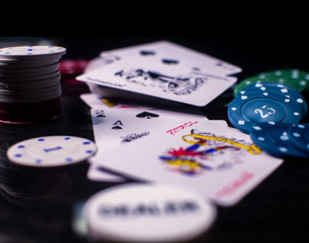 poker chips and cards on a black background, close-upの写真素材