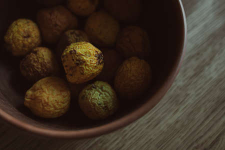 Rural still life. The fruits of the garden fruit tree. Overripe quince. Shriveled quince peel....