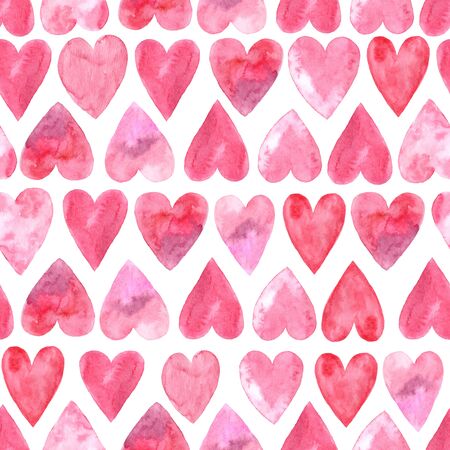 Seamless pattern with bright pink hand painted watercolor hearts. Romantic decorative background perfect for Valentine's day gift paper, wedding decor or fabric textileの写真素材