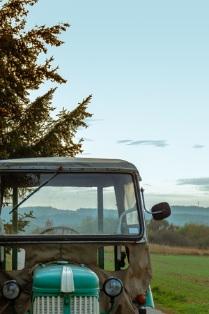 Tractor in front of fieldの写真素材