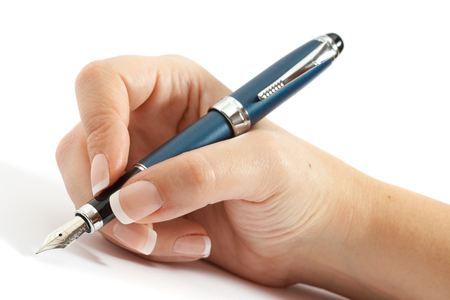Female hand holding beautiful fountain pen isolated on white backgroundの写真素材