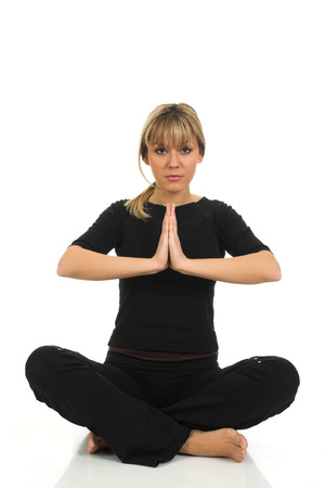 Young beautiful girl sitting isolated on white backgroundの写真素材