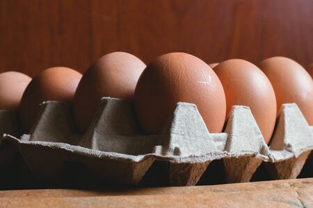Eggs in carton box on rustic background, bogota colombia, april 4, 2020