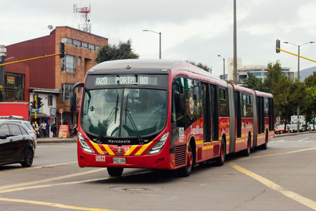 Avenida Calle 80, BogotÃ¡ Colombia, buses of the massive Transmilenio system, July 2, 2022のeditorial素材